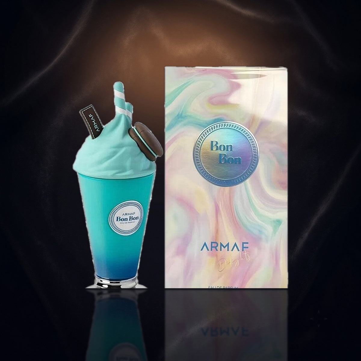 Delights Bon Bon — Armaf, frasco y caja (fondo oscuro)